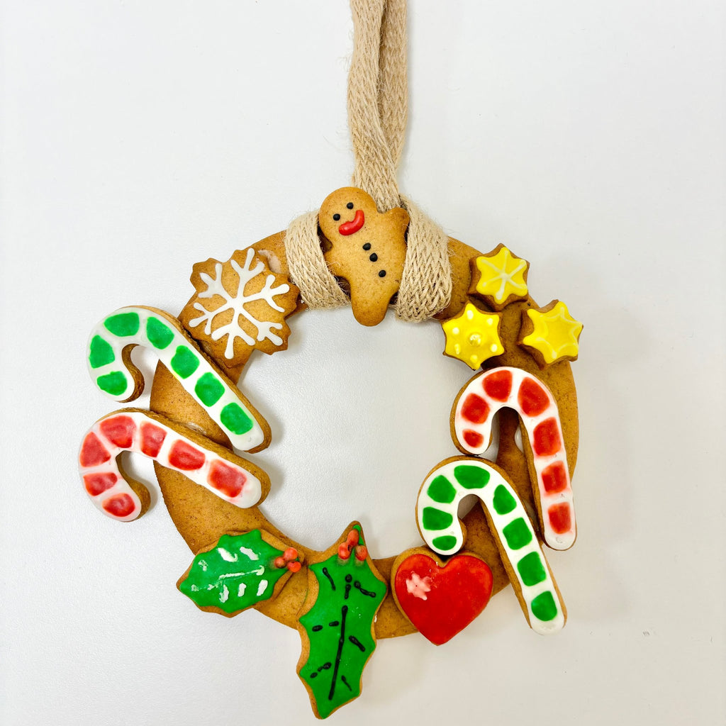 gingerbread wreath with iced biscuits stuck on.