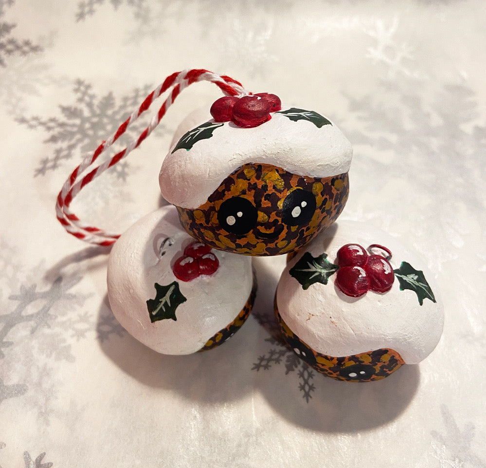 clay christmas puds with bakers twine hanger and holly on the top