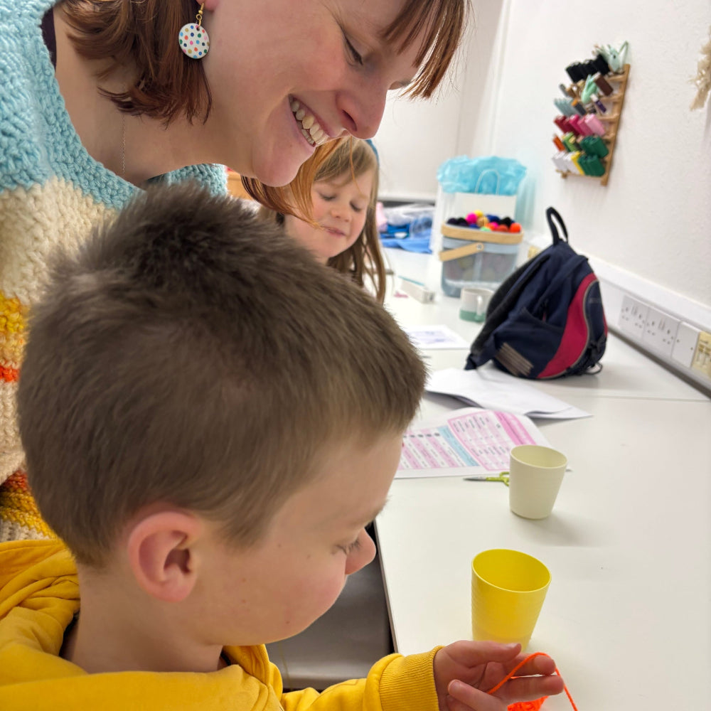 mum and son crocheting at crochet club