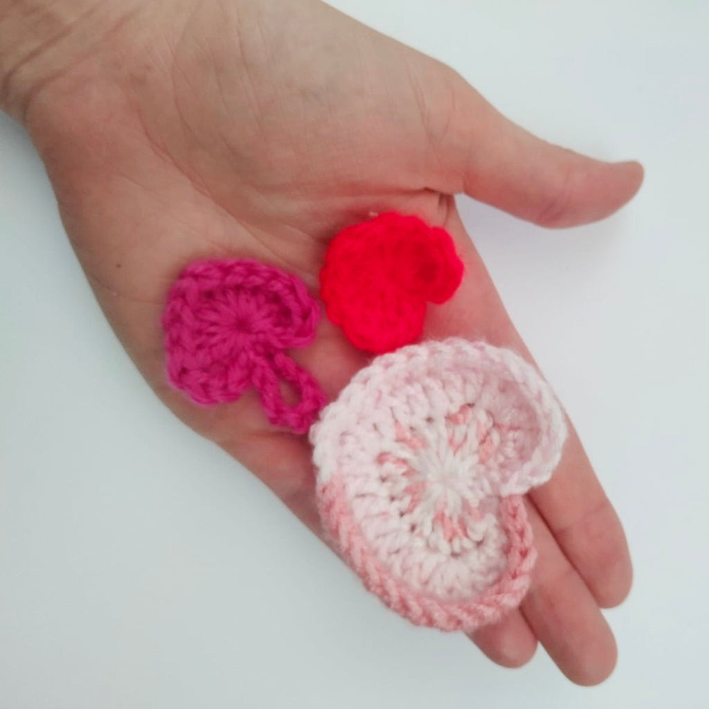 crochet hearts in hand