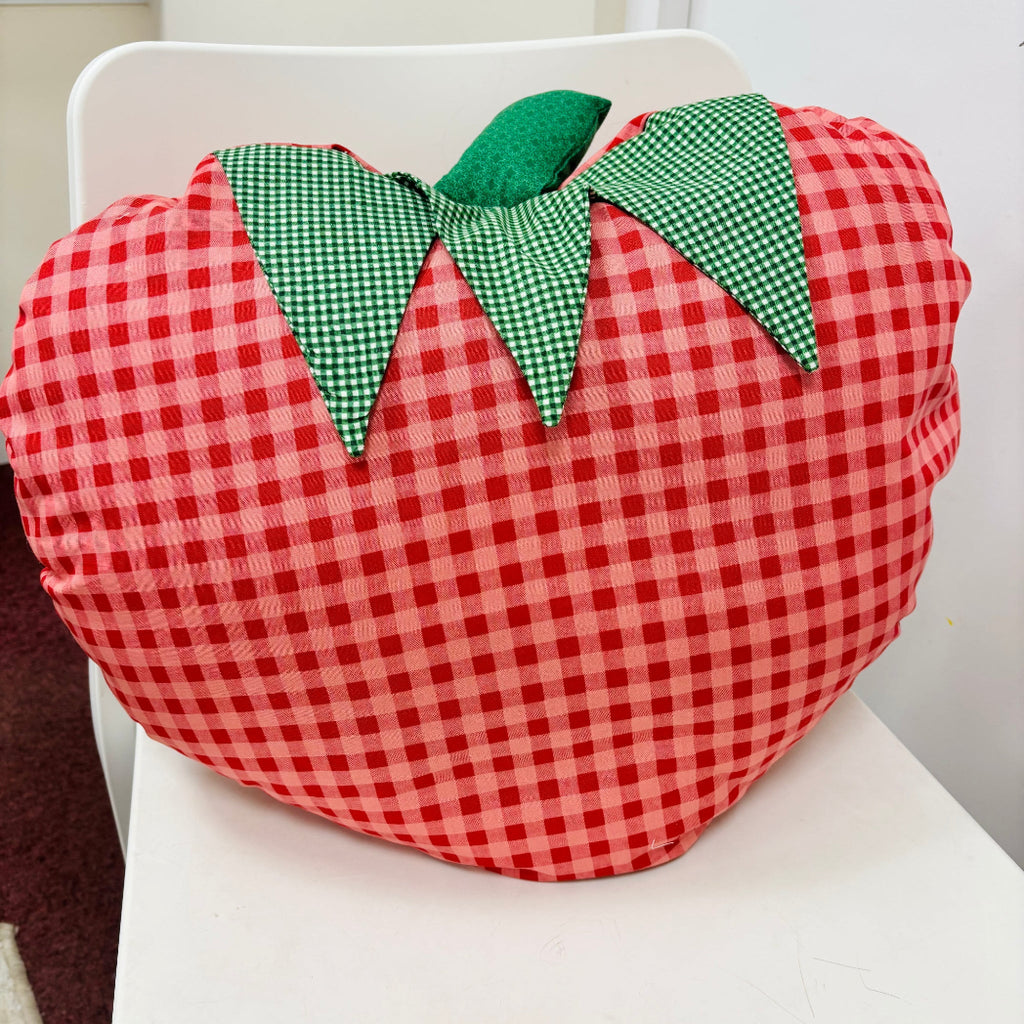 strawberry cushion from red gingham fabric on white chair