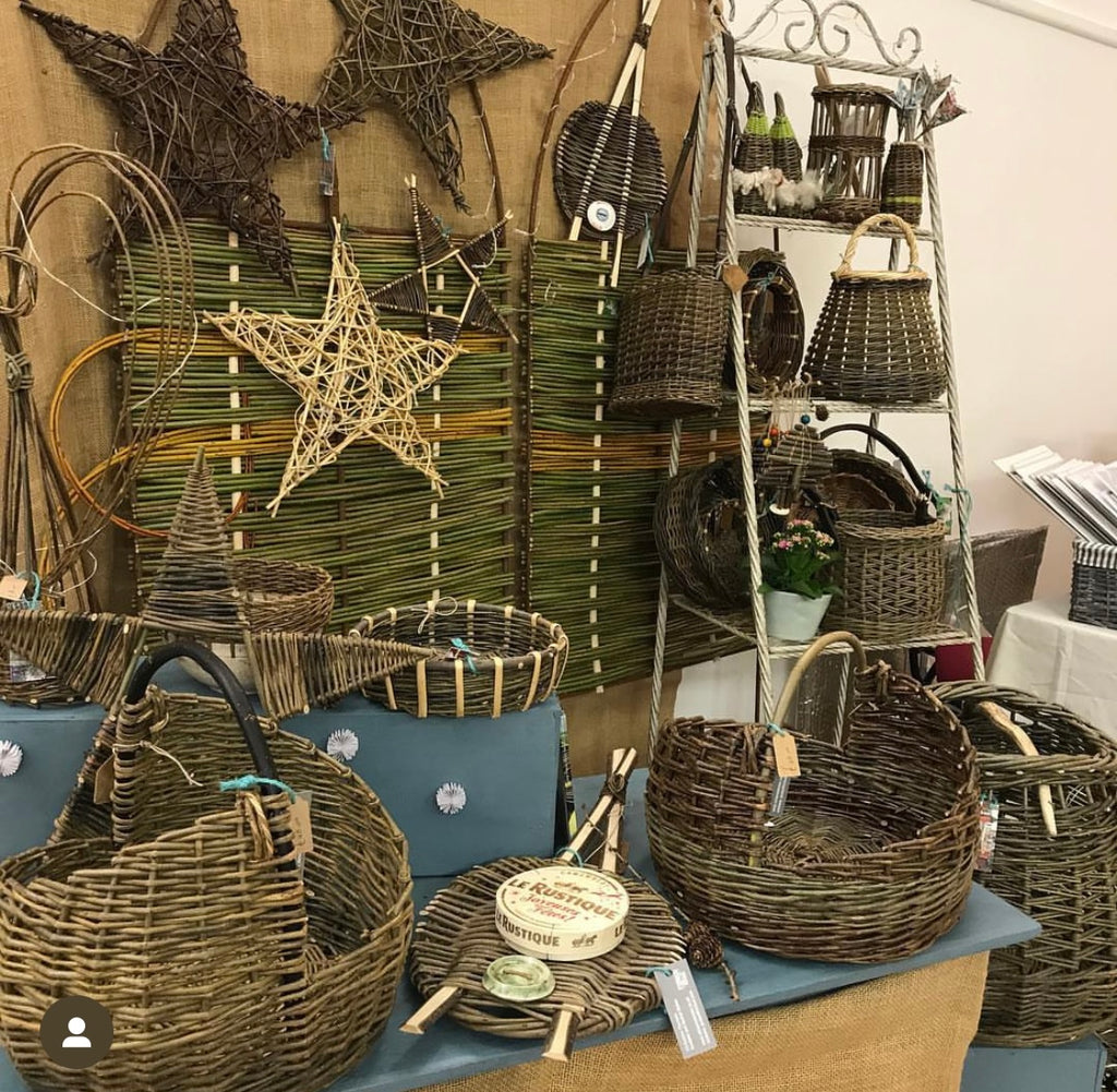 an array of willow crafts including baskets, cheese platter, willow stars and much more.